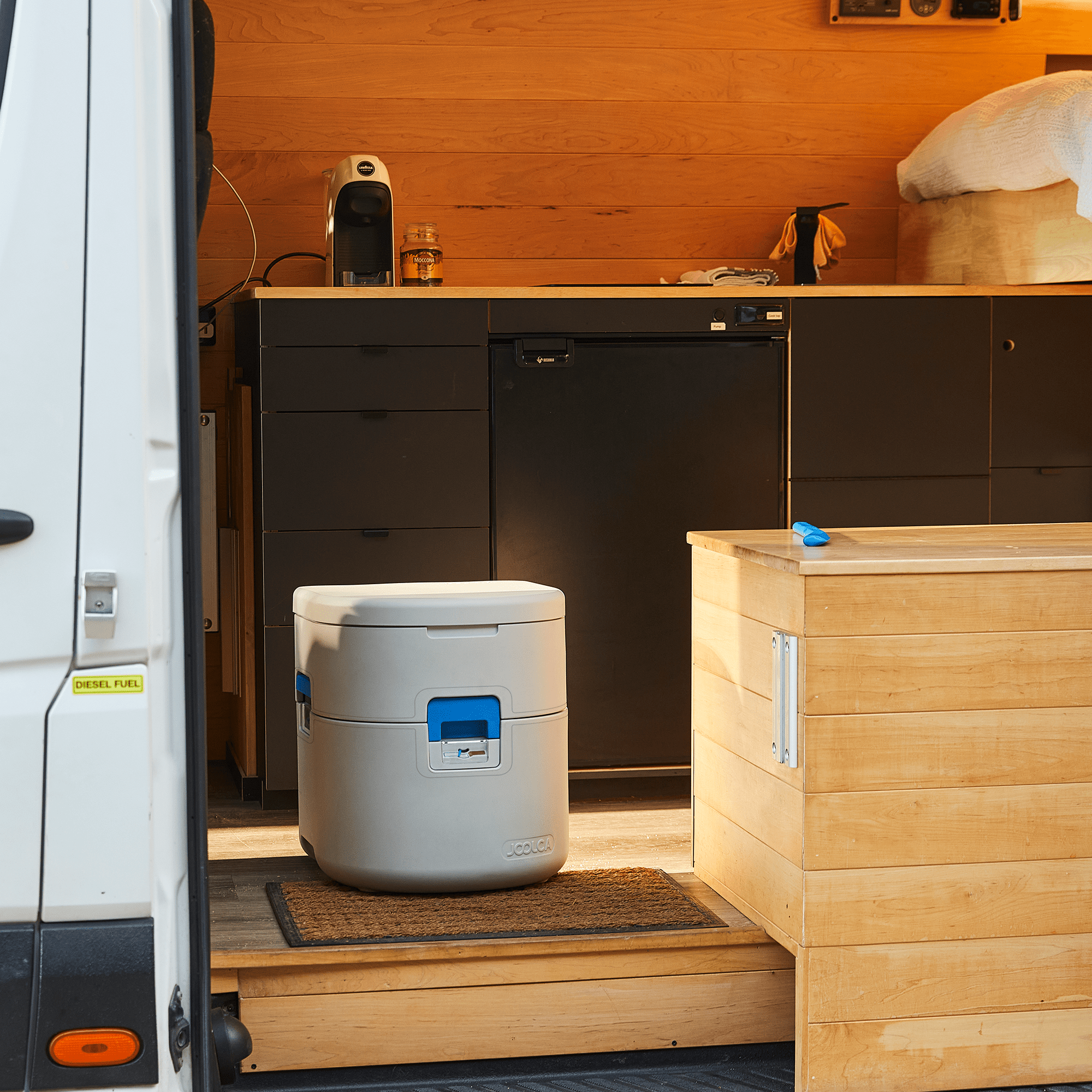 GottaGo portable toilet inside van with wooden interior
